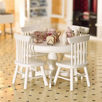 White Circular Table & Four Chairs                          